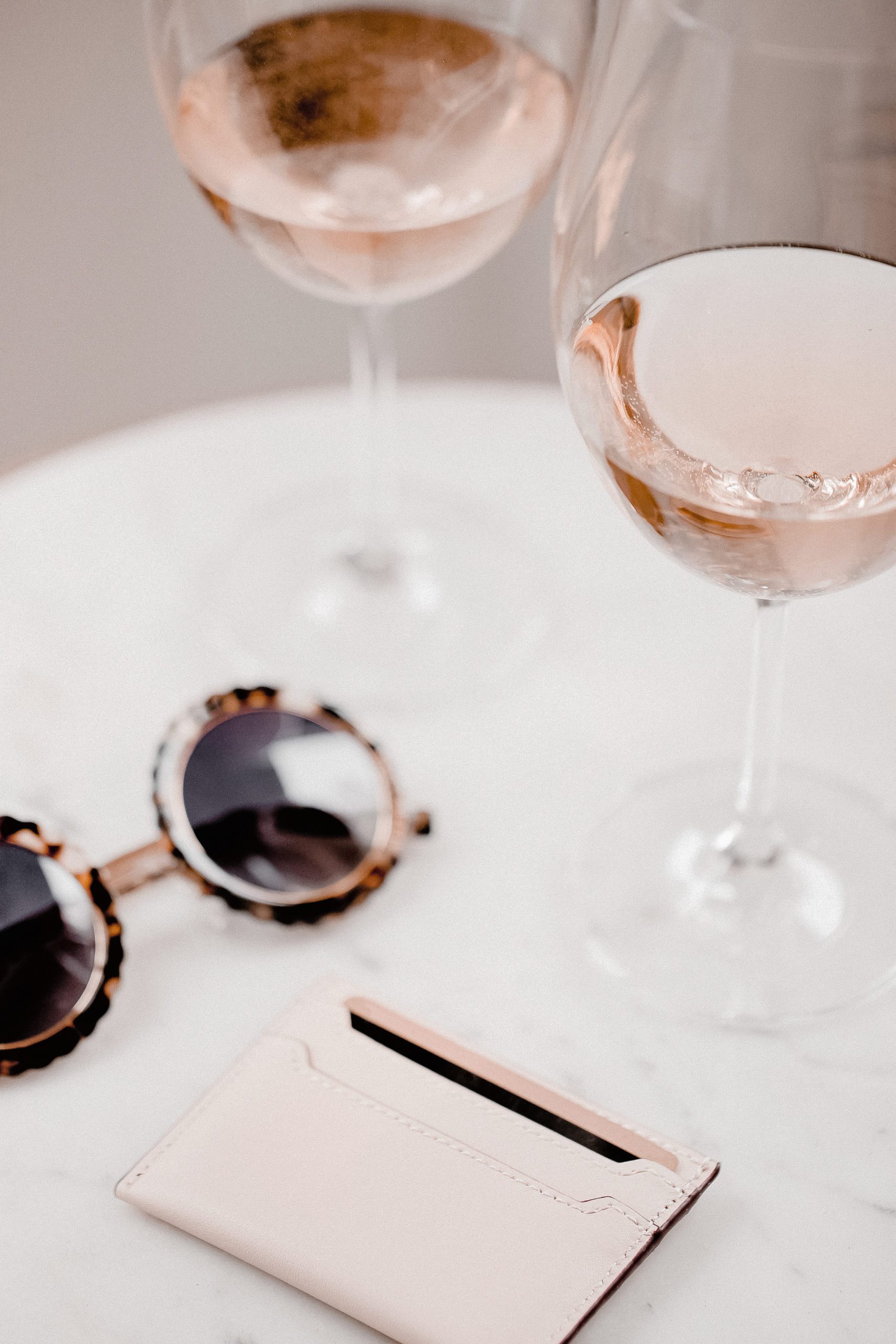 wallet sunglasses wine glasses